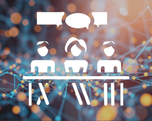An image of interworkings of technology - like a web of connected wires with a graphic overlaid showing three stick figures at a desk with conversation bubbles over their heads for a panel discussion